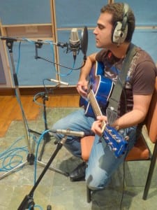 A singer songwriter mic'ed up and ready to record.